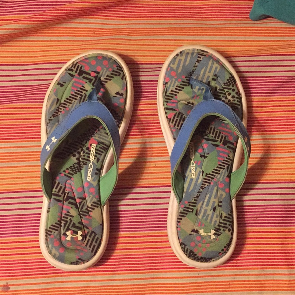 green blue pink and black under armour flip flops